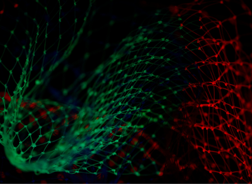 Green and red Christmas lights glowing in a dark space