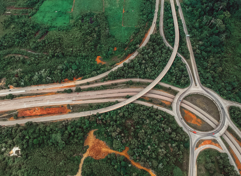 Abstract highway roads surrounded by trees 