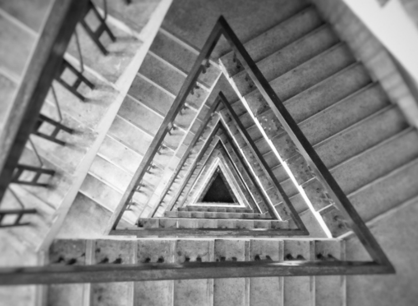 A bird's eye view of a staircase shaped like a triangle