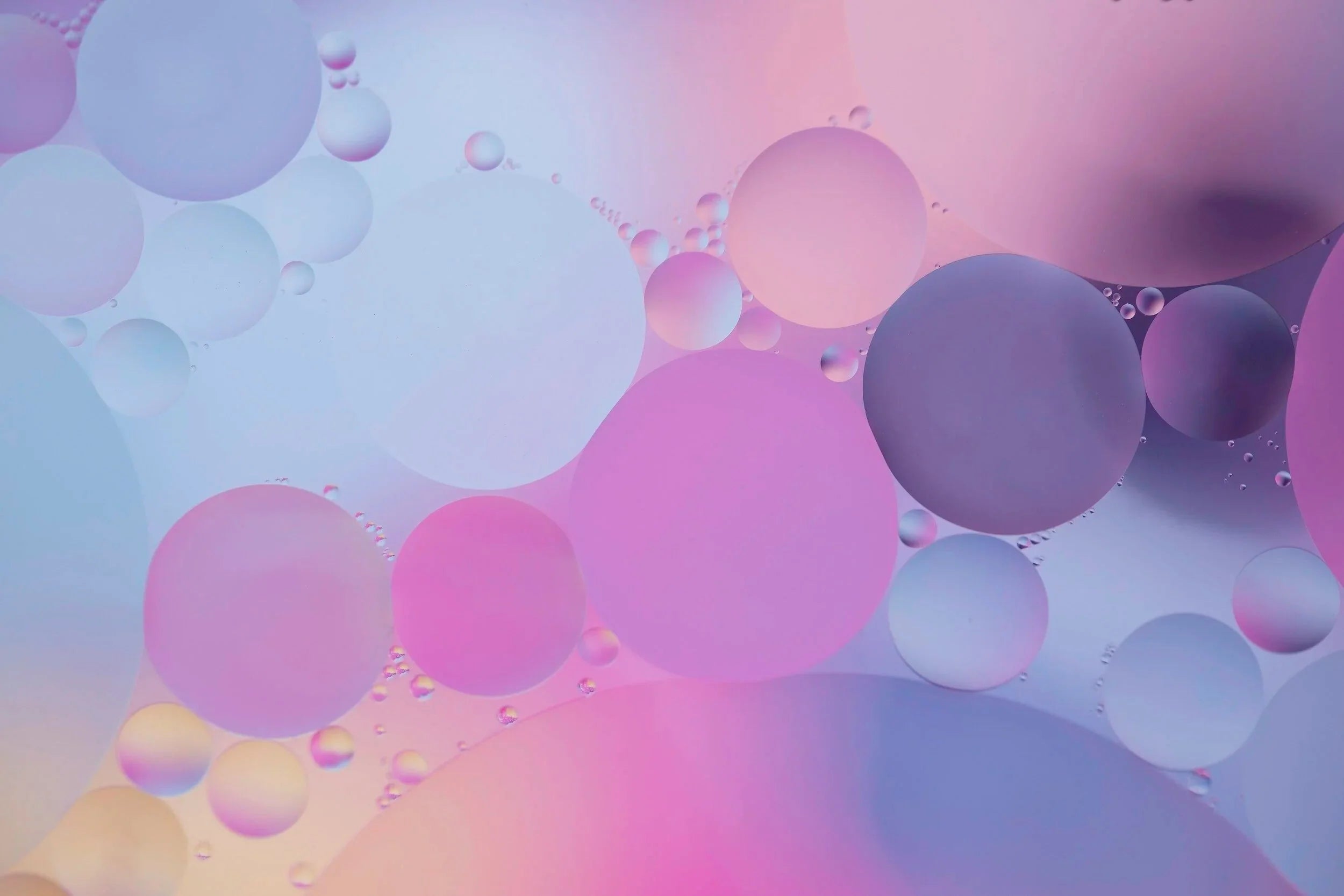 Purple, pink, blue and orange circular bubble-like abstract image